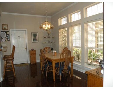 Dining Room. The wood floors of the dining area gl