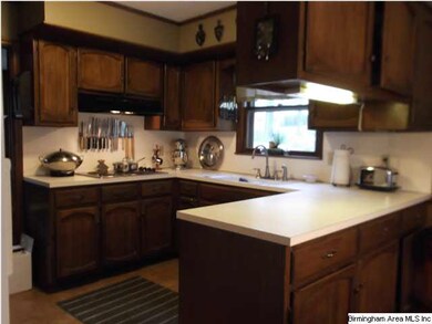 KITCHEN WITH DOUBLE OVEN AND COOKTOP