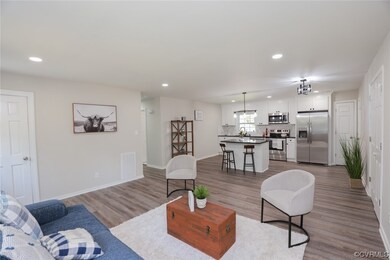 View of hardwood floored living room