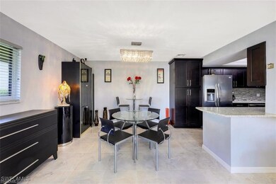 Dining space featuring light tile patterned floori