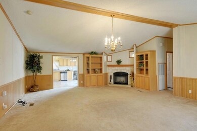 Den with Corner Fireplace and Built-in Cabinets