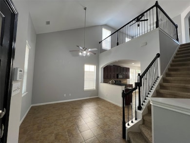 Entryway from the front door, tall ceilings and open concept.