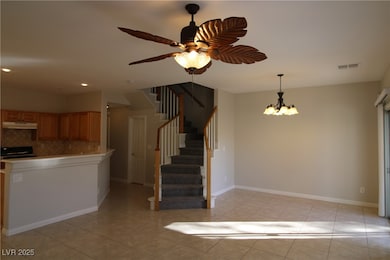 Kitchen featuring a chandelier, light tile pattern