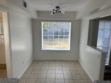 Unfurnished dining area with a notable chandelier,