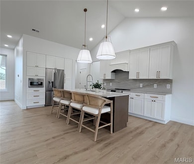 Kitchen featuring Full Height Quartzite Backsplash