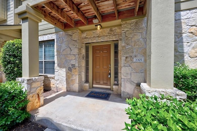 View of exterior entry with stone siding