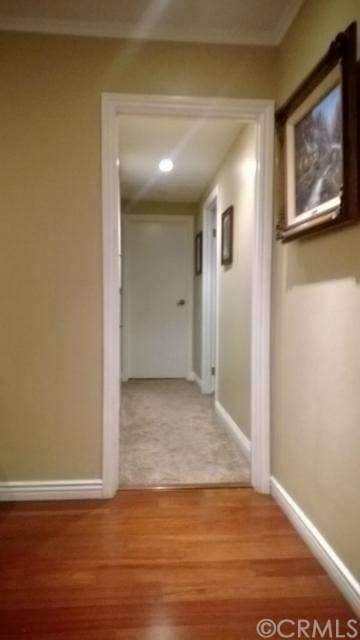 Clean fresh paint and flooring leading through the