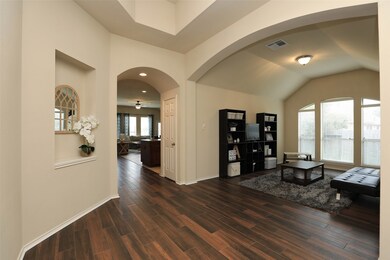 Wide, open foyer looking into the bonus room.