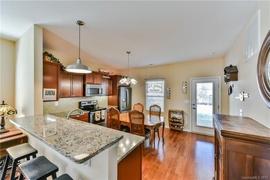 Large eat-in kitchen with granite counters.