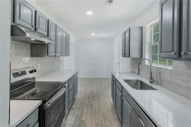 Kitchen featuring appliances with stainless steel 