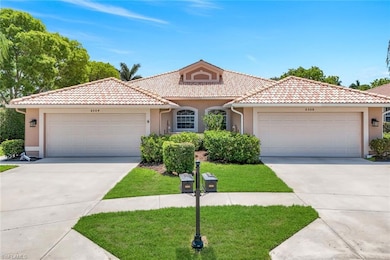 Mediterranean / spanish house featuring an attached garage, concrete driveway, and stucco siding