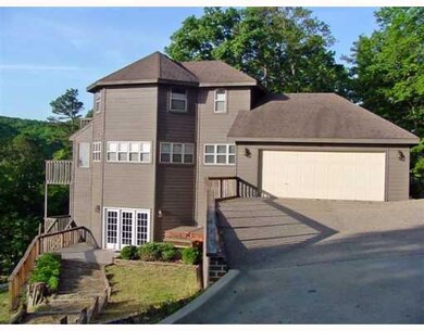 Exterior Front. This striking home is tucked neatl