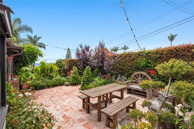 An inviting front yard with colorful landscaping sets the stage for spontaneous gatherings with friends and neighbors.