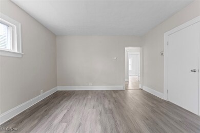 Empty room with wood-type flooring