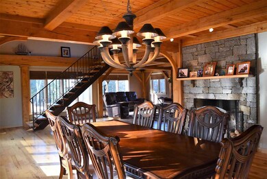 Love the stone fireplace and all the handsome beam