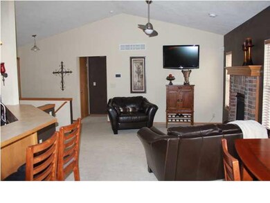 Living room view from dining nook. Vaulted ceiling