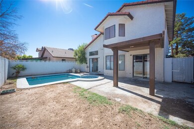 View of swimming pool featuring a hot tub, a patio area, and a fenced backyard
