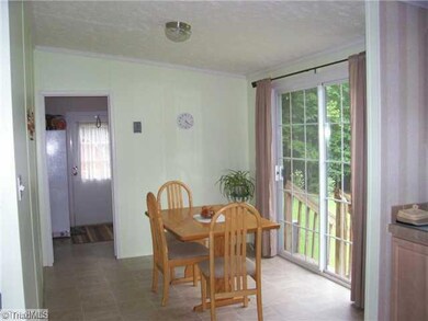 Breakfast. Enjoy your coffee and breakfast while enjoying the view of nature.  Trough the left doorway is a large laundry room area that is not pictured.