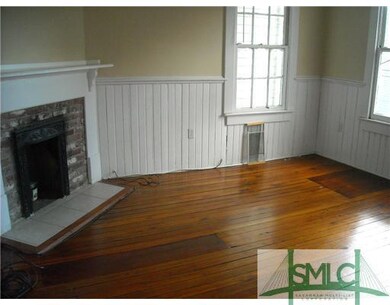 Living Room. Note the beautiful hardwood floors an