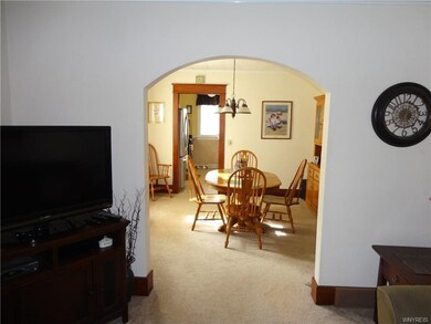 The living room flows into the dining room with lo