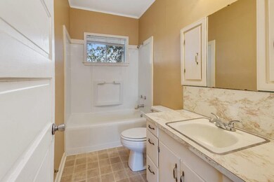 Bathroom:  Shower/Tub combination; vinyl flooring;