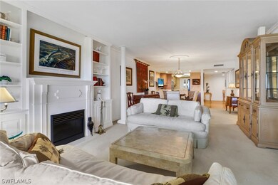 Carpeted living room featuring built in features