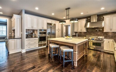 Highlights of the kitchen: a large island w/ a mar