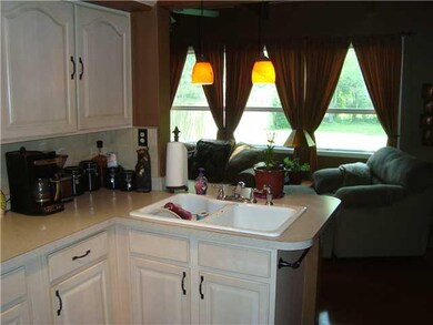 Kitchen Kitchen with family room in the background
