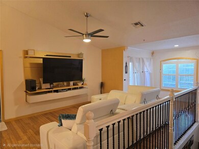 Volume ceilings, bamboo flooring, iron and wood railing, plantation shutters, built in entertainment, sliding doors to balcony.