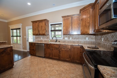Granite throughout, tile backsplash