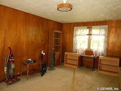 Den. The breezeway room, between the garage and th