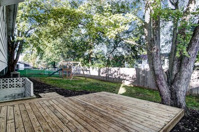 Fenced back yard with deck