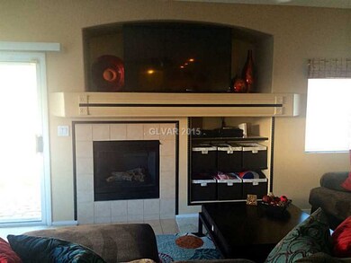 Living Room. Tiled fire place and shelving for sto