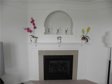 Family Room. Beautiful Marble Fireplace in First F