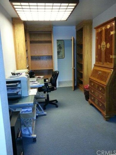 open office area with built in book shelves