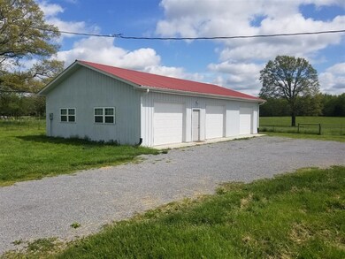 The three bay garage/workshop has new insulated do