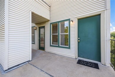 Doorway to property featuring a patio