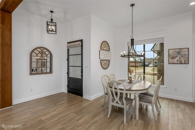 Dining area featuring crown molding, hardwood / wo