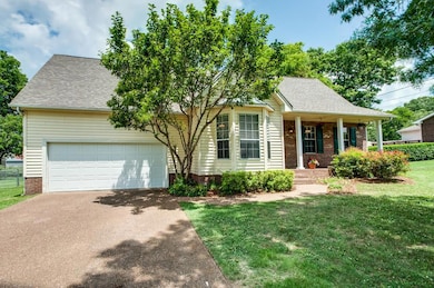 Notice the big bay window in the living room and big shade tree in the front yard.