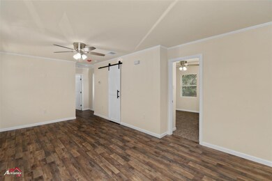 Unfurnished room with dark hardwood / wood-style f