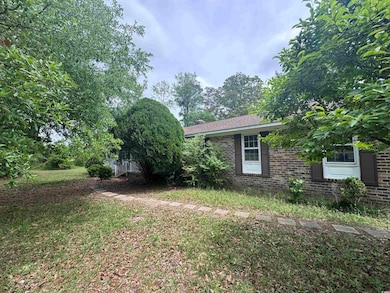 View of side of home featuring brick siding