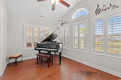 Sitting room featuring a ceiling fan, visible vent