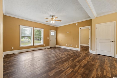 Unfurnished living room with a textured ceiling, c