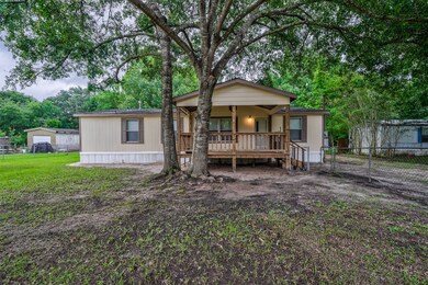 You'll love the mature hardwoods and the fully enclosed fence.  Check out that nice covered front porch too!