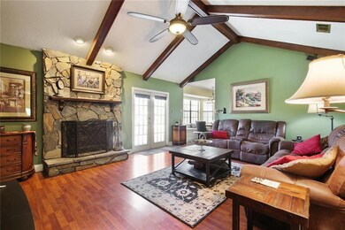 Stone fireplace in den.
