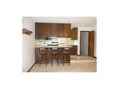 Kitchen. Kitchen with breakfast bar opens to famil