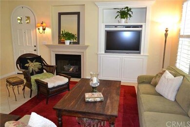 Arched front entrance, fireplace, and plantation s