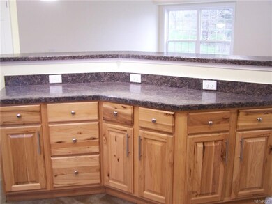 Kitchen counter and bar area overlooking living ro
