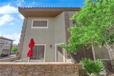 Back of house featuring stucco siding