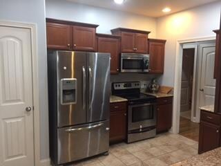 Stainless appliances , granite counters, tile floors and nice pantry 